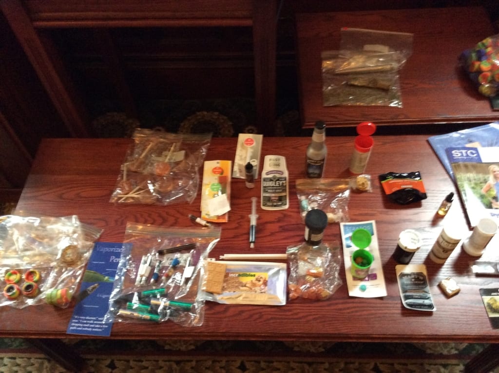 An array of legal consumable marijuana products, including edibles, liquid, and smoking form.