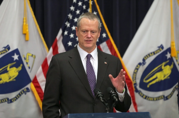 BOSTON, MA - 3/23/2020: Governor Charlie Baker orders closure of all non-essential businesses because of CORVID-19 coronavirus with an announcement at the Massachusetts State House. (David L Ryan/Globe Staff ) SECTION: METRO TOPIC:921
