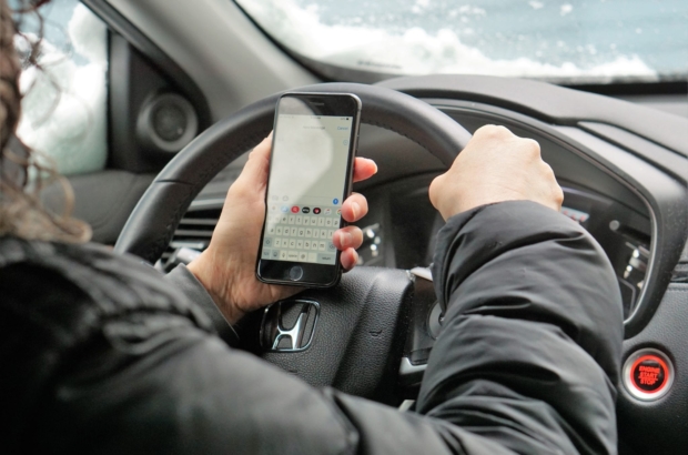 Pass a ban on drivers using hand-held phones, Massachusetts