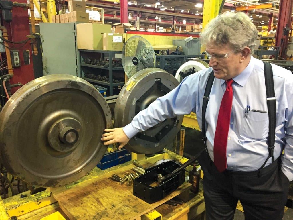 Ed Belanger, superintendent of the T's Everett repair shop, explains how the T reduced the ear-piercing sound of the trolley wheels.