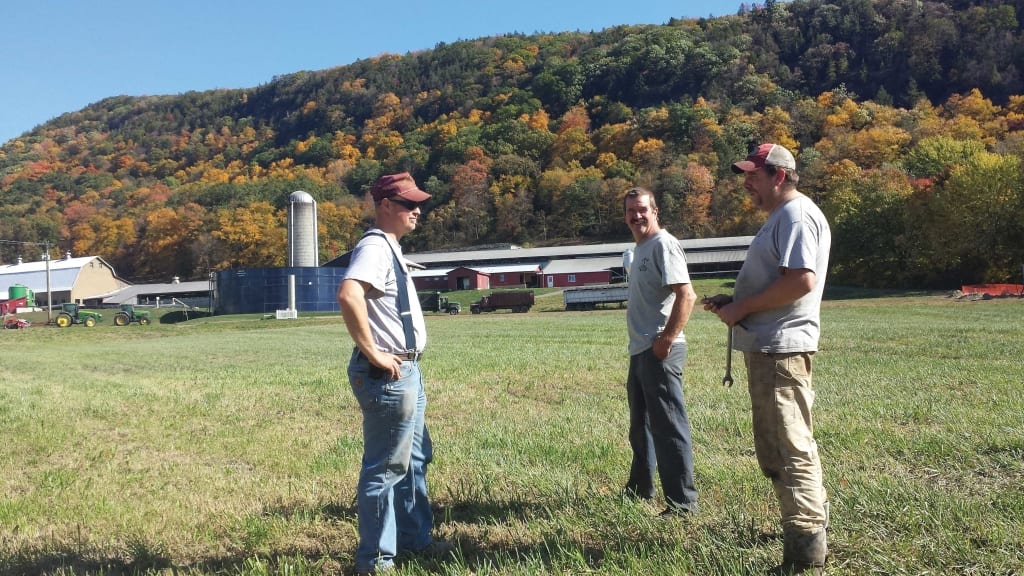 At the foot of Mt. Holyoke in Hadley, the sign out front says Barstow’s Longview Farm: Looking forward since 1806. From left, Rob Adair, a private contractor (excavator) working at the farm, Dave Barstow, and Steve Barstow II.