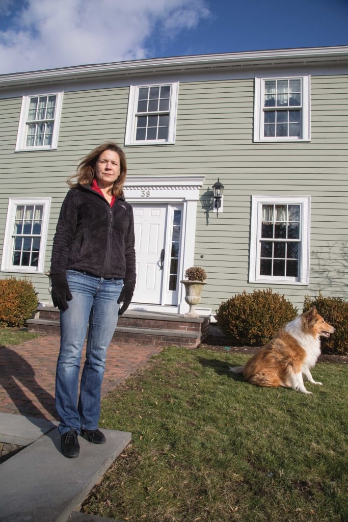Shae Ranalli outside her family’s historic home in Andover that had been a nightmare renovation project.